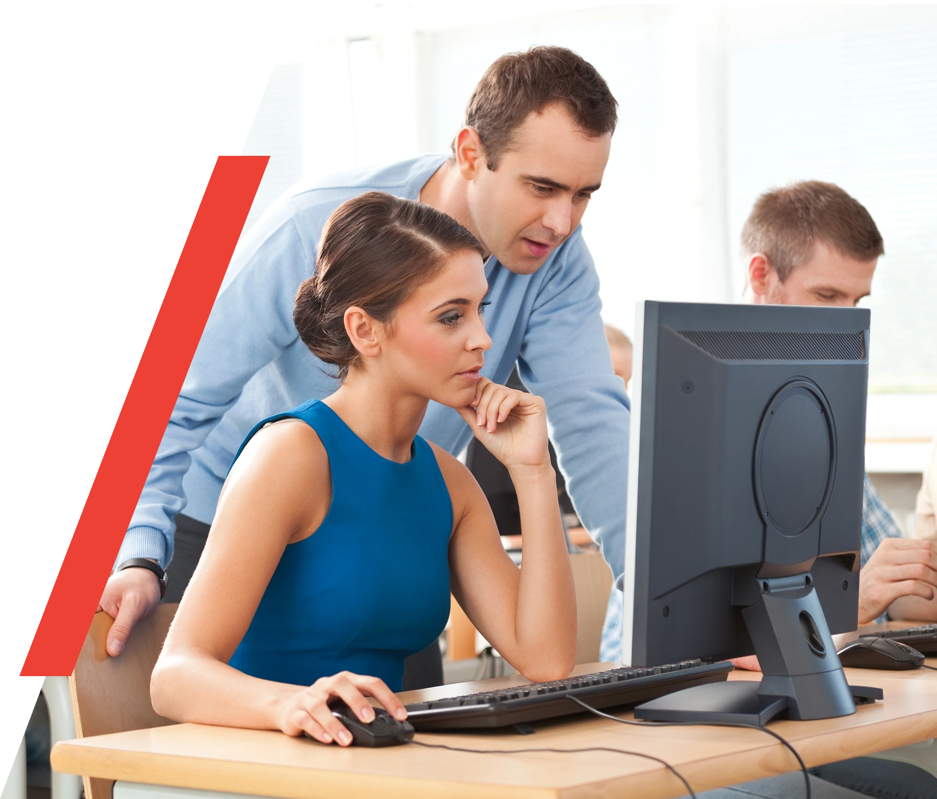 People working together at a computer.